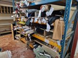 many rolls of fabric on the shelves in the warehouse