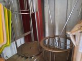 a metal shelf with pots and pans on it