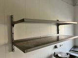 two shelves on the wall above a sink in a kitchen