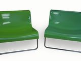 pair of green chairs with chrome legs on a white background