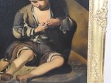 a painting of a man sitting on the ground reading a book