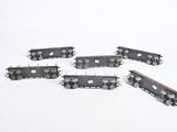 five train cars that are sitting in the snow