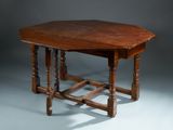 a small table with a wooden top on a grey background