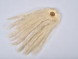 a long white hair with a wooden button on it