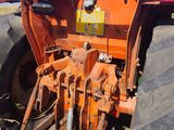 a tractor that is sitting in the dirt