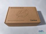 the box is open on the table with the mouse in it