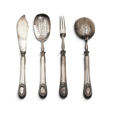 three spoons, a fork, and a spoon rest on a white surface