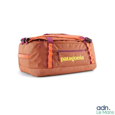 a duffel bag that is sitting on a white surface
