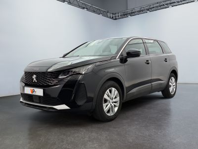 the new peugeot suv is parked in a large room