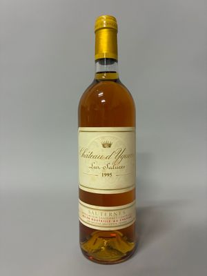 the bottle of wine is sitting on the table ready to be filled