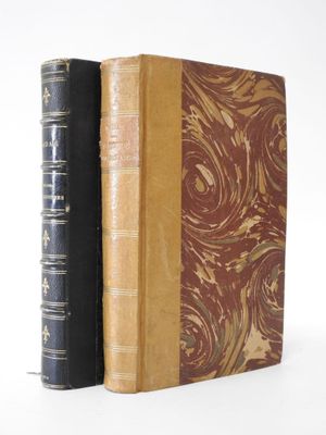 two books sitting side by side on a white surface