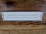 a white light that is sitting on a wooden table