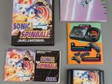 several video games on a table with a game controller