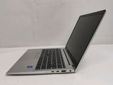 a laptop that is sitting on a white table