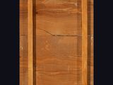 a close up of a wooden door with a black background