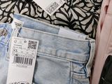 a close up of a pair of jeans with a price tag on it