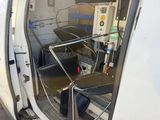 a white van with a table and chairs inside of it