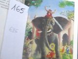 un livre ouvert sur lequel figure l'image d'une femme chevauchant un éléphant