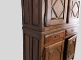 an image of a wooden cabinet with doors and drawers
