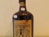 a bottle of liquor sitting on a counter top