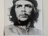 an old photo of a man in a military uniform with a star on his hat
