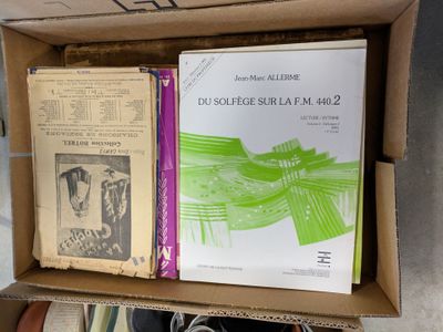 a box full of books sitting on top of a table