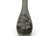 a vase that has a picture of a tree on it