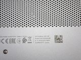 a close up of a metal plate with a qr code on it