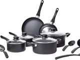 an image of a set of pots and pans with utensils