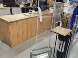 a man that is standing next to a table in a store