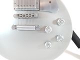 a white electric guitar that is sitting on a table