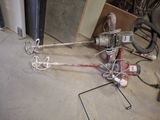 a picture of a broken drill and other tools on the floor