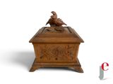 an image of a wooden box with a bird on it