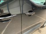 a close up of a car ' s door handle and door handle