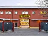 a red building with a yellow sign on the front of it