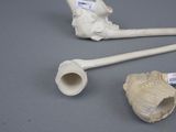 two pipe holders and a pipe holder on a table
