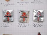 four badges on a piece of paper with a cross on them