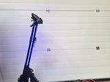 a scooter that is parked in front of a garage door