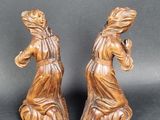 pair of carved wood figures of a woman and a man