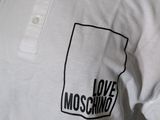 white polo shirt with black and white logo on the chest
