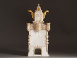 a statue of a tower with a clock on top of it