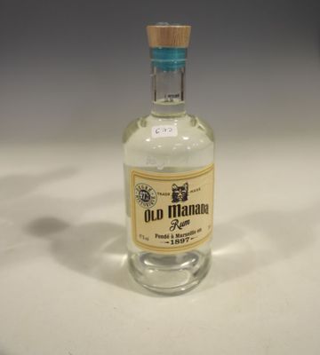 a bottle of old havana tequila sitting on a table