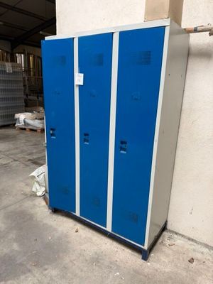 two blue lockers next to each other in a garage