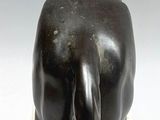 statue of a woman sitting on a horse on a marble base