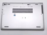 a laptop that is sitting on a white surface