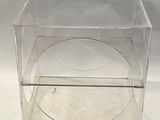 a clear plastic box with a clear lid on a white surface
