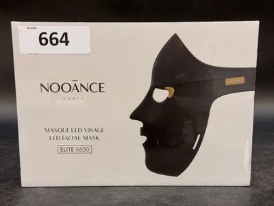 a box with a mask on it on a table