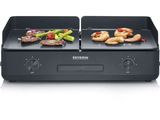 an image of a grill with meat and vegetables on it