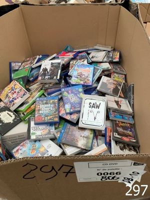 a cardboard box full of dvds and games for sale
