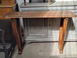 a small table with a laptop on it in a room